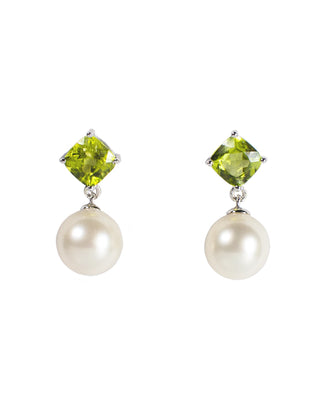 Pair of earrings with green peridots and white pearls on a white background