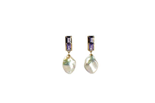Pair of earrings with baroque pearl drops and amethysts on a white background